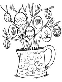 Asztali dísz húsvéti tojások ágakon